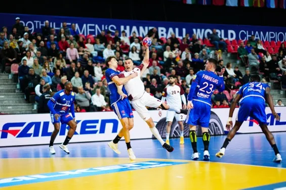 Handball players compete in front of a FALKEN courtside LED board at the 29th IHF Men's Handball World Championship.