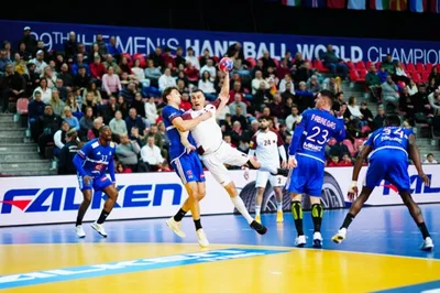 Handball players compete in front of a FALKEN courtside LED board at the 29th IHF Men's Handball World Championship.