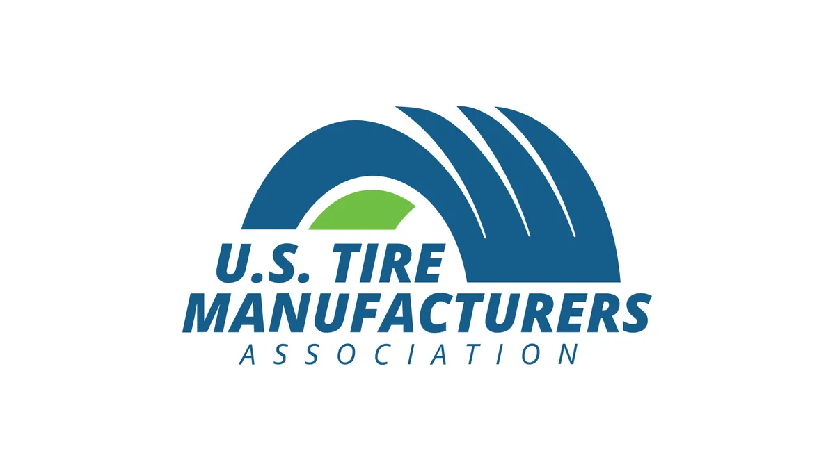 U.S. Tire Manufacturers Association logo, a blue tire-shaped arch with a green center and the association name in blue letters, centered on a white background.